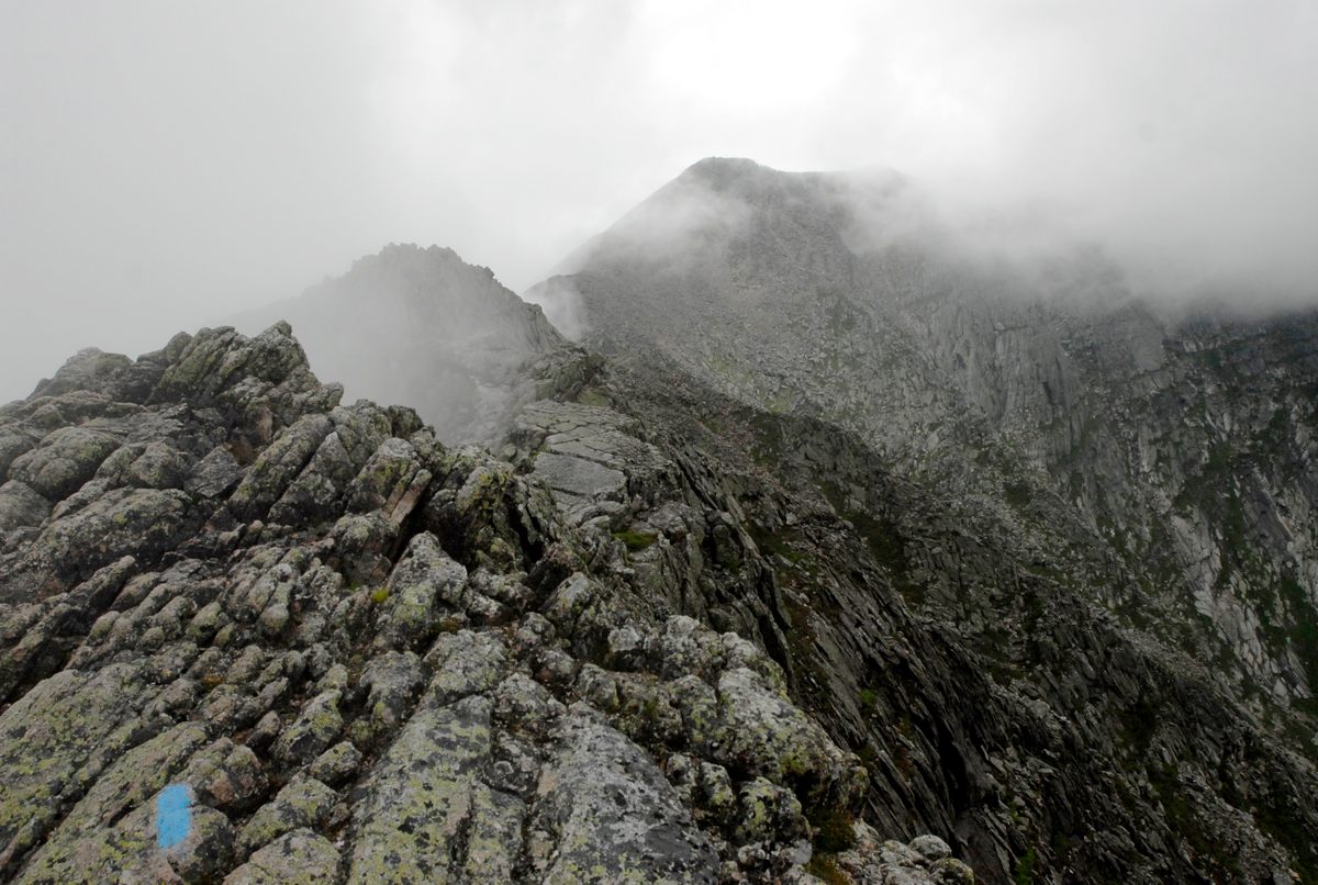 A blue marker points the way for hikers through challenging terrain near the Appalachian Trail's northern terminus, at Maine's Mt. Katahdin.