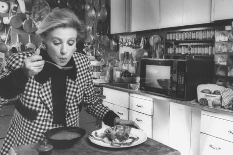 Barbara Kafka tastes a bowl of lobster broth that she made in one of her many microwaves.