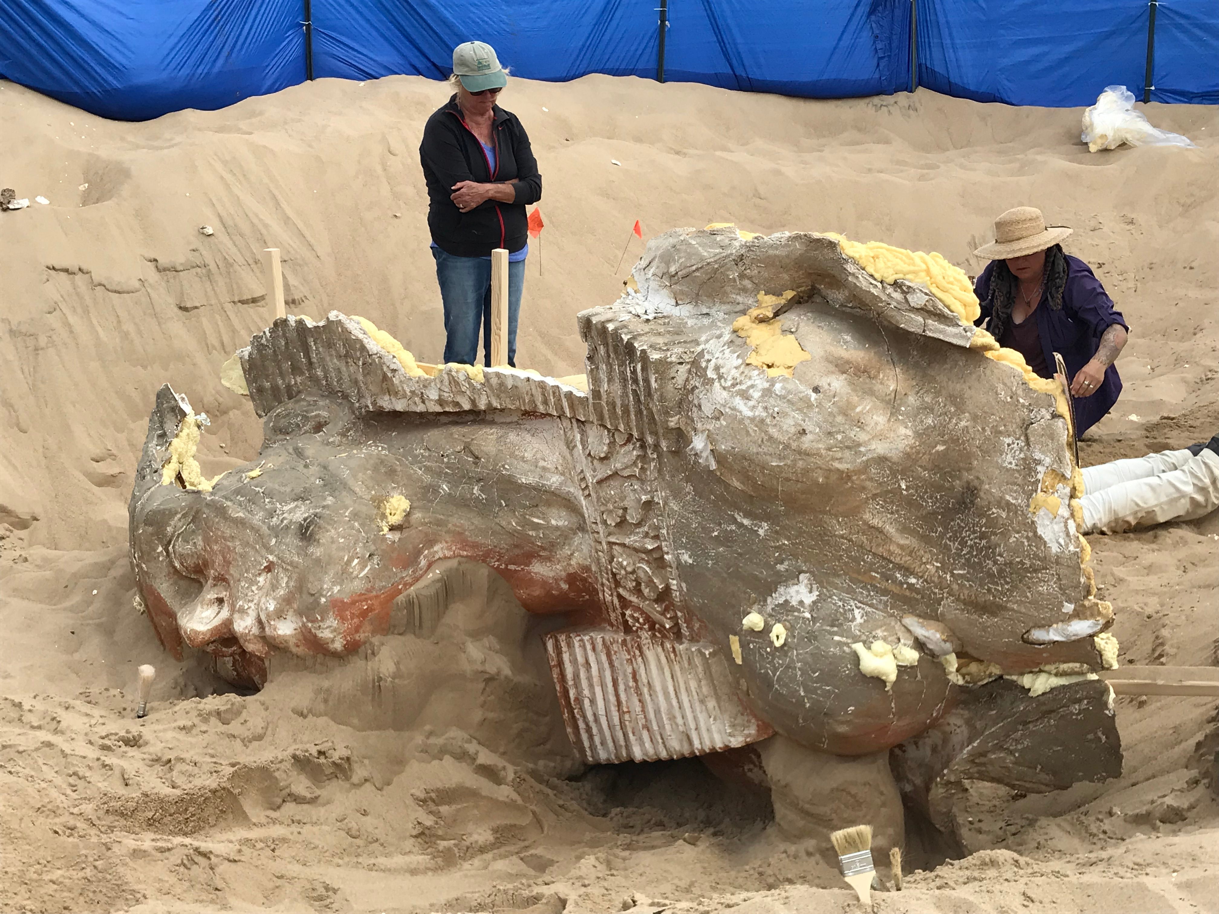 The dry sand has kept the detail on the necklace and headdress in near-perfect condition.