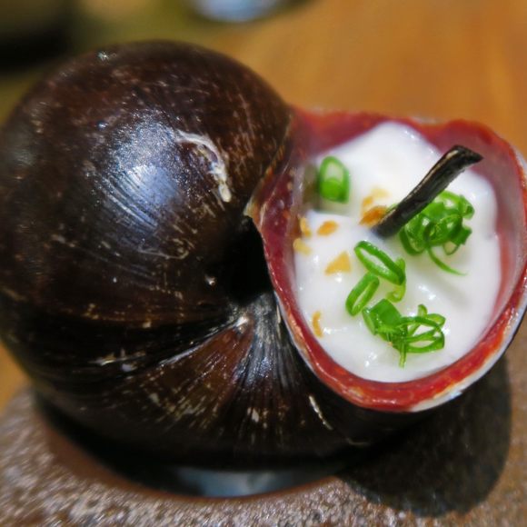 A churo snail simmered in soy with dale dale root foam at Maido, a restaurant in Lima.