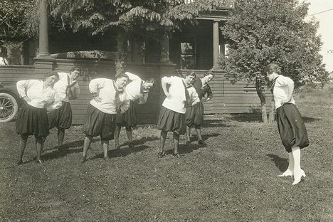 Women exercising in bloomers, circa 1914. 