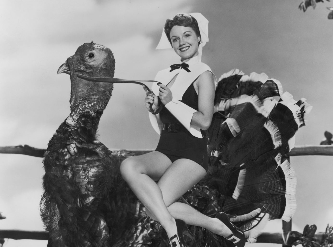 There are Puritans and then there are Puritans, like actress Virginia Gibson, photographed circa 1952, before almost all turkeys were white. 