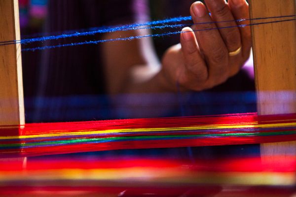A close-up of Alejandra Micaela Ujpán weaving.