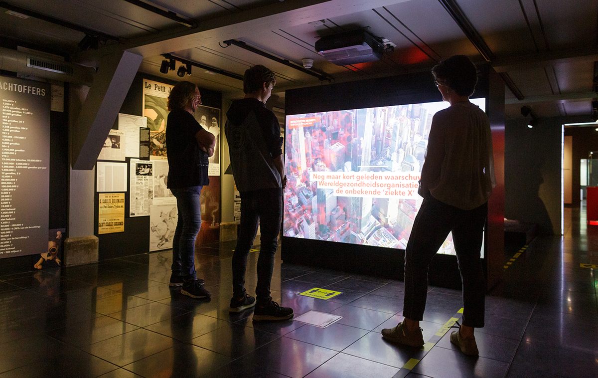 As museumgoers walk into the Rijksmuseum Boerhaave's exhibit they are greeted with a news reel of major COVID-19 moments.