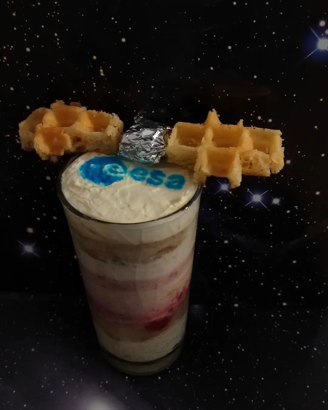 This layered smoothie features waffle cut-outs representing Juice's solar panels.