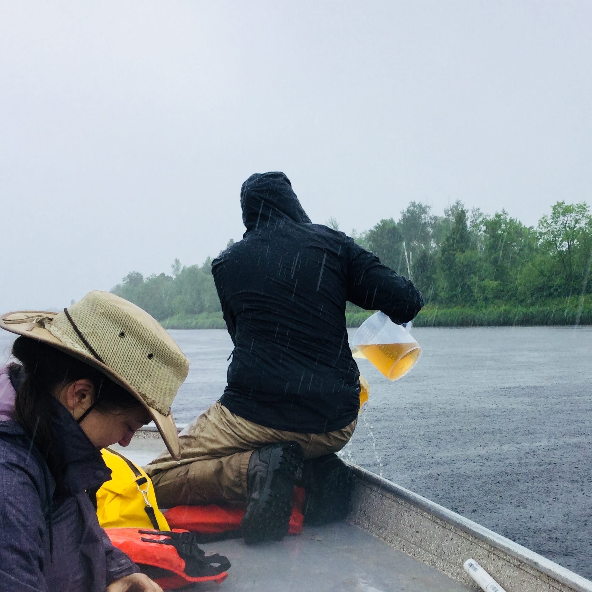 Another volunteer braves the rain.