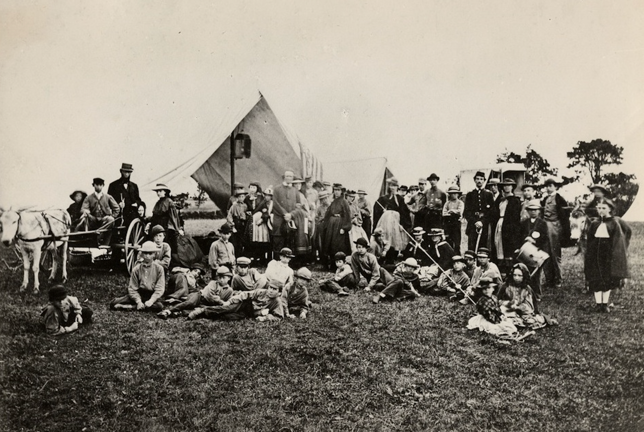 The American summer camp tradition arguably began in 1861 with Connecticut educator Frederick Gunn's "Gunnery Camp," where children fished, foraged, and practiced military drills.