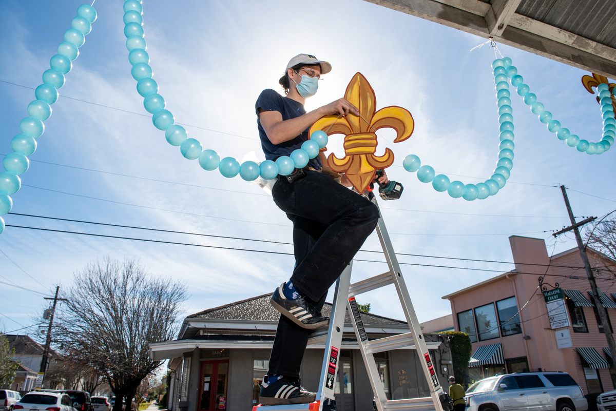 Royal Artist Travis Keene installs work for the seventh house float, "Butterflies of Winter" at the Mignon Faget gallery.