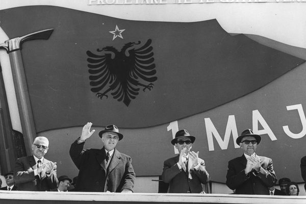 Communist officials from the ruling Albanian Party of Labour including Enver Hoxha, 2nd from left, wave and clap during national celebrations, 1973.