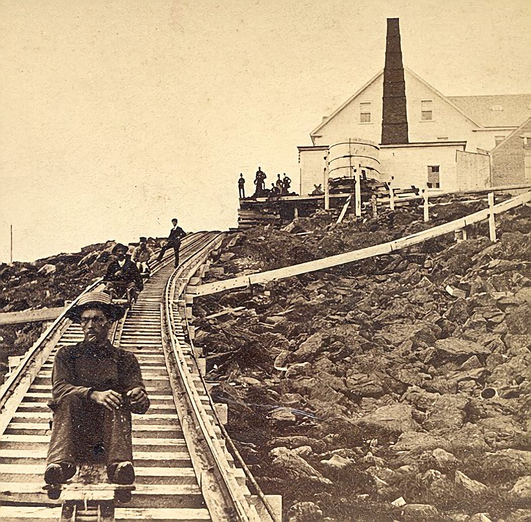 Track workers ride a “Devil’s Shingle” down Mount Washington.