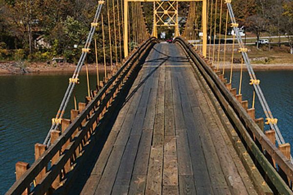 Beaver Bridge, a one-lane, wooden suspension bridge, is the only one in Arkansas that you can still drive over.