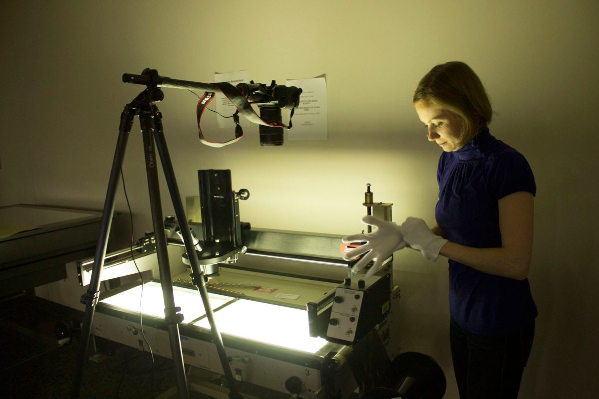 Using a light table, landscape archaeologist Emily Hammer (the author) prepares to photograph U-2 negatives at the National Archives’ Aerial Film Section.
