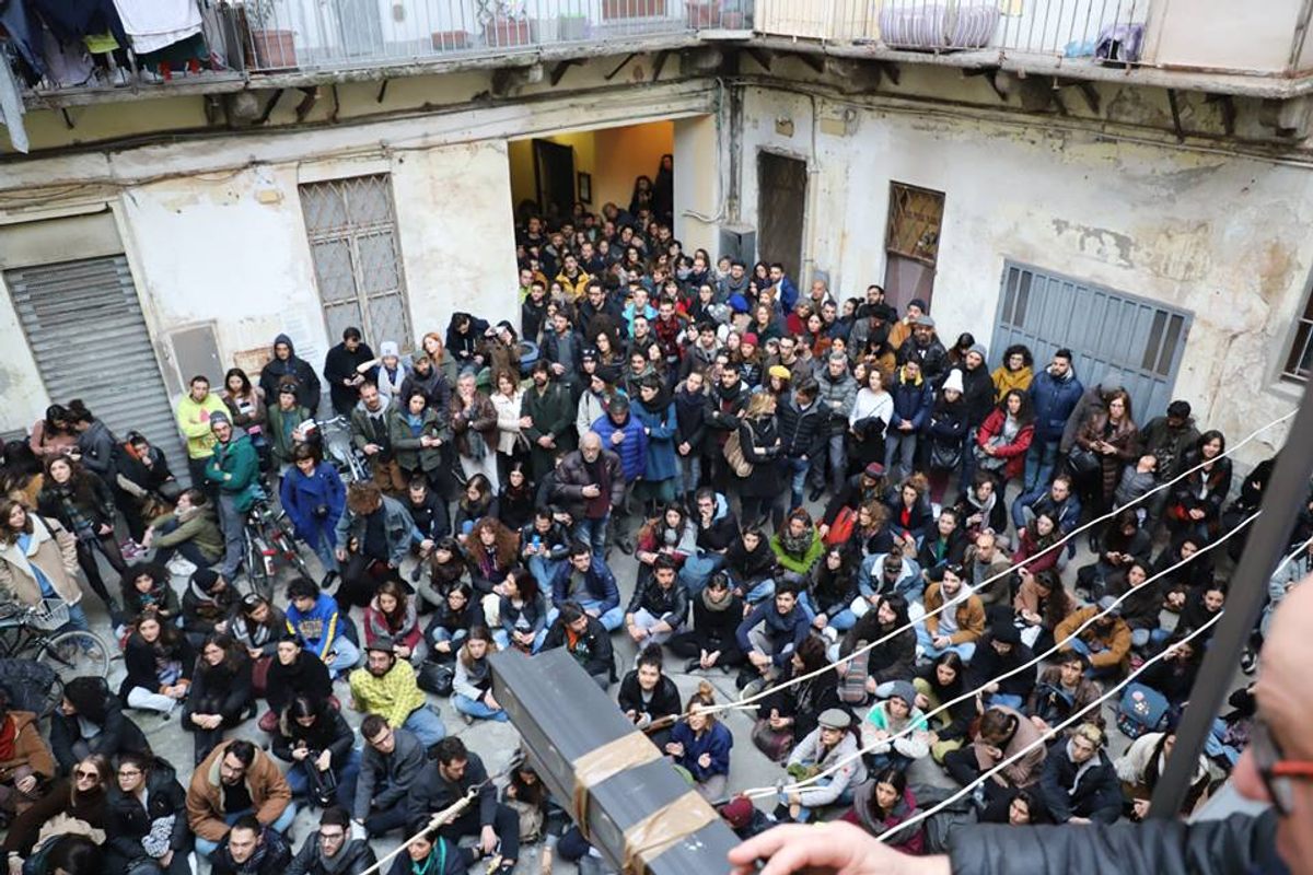 Concerts are advertised on social media, and event goers, shown here in 2019, ring the couple's doorbell for access to the courtyard.
