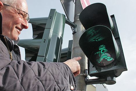 The mayor of Trier poses for a photograph with the new lights.