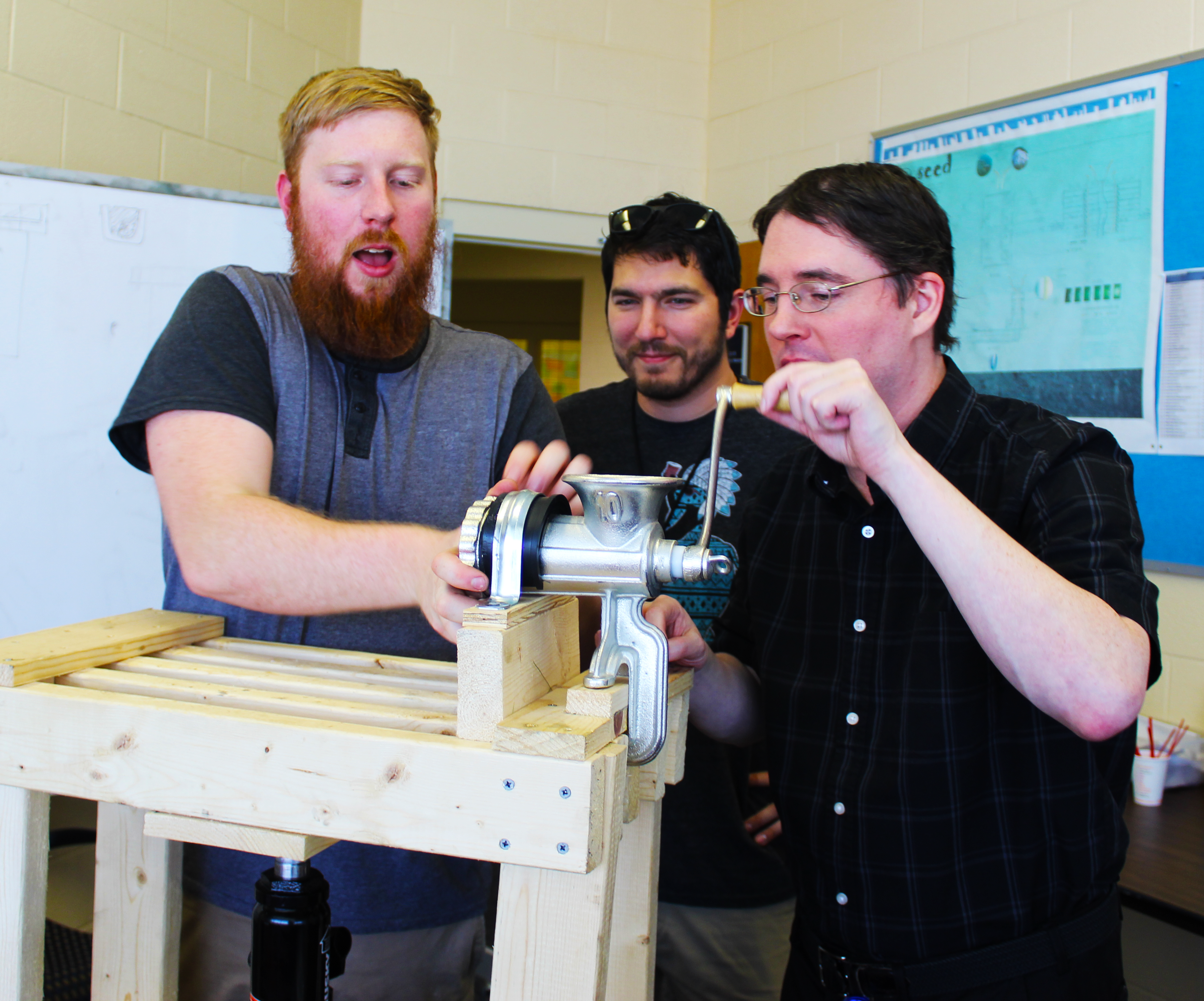 Members of the ALLFED team explain the process of making leaf concentrate.