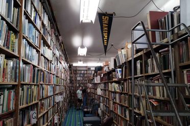 A row of bookshelves within Hyde Bros