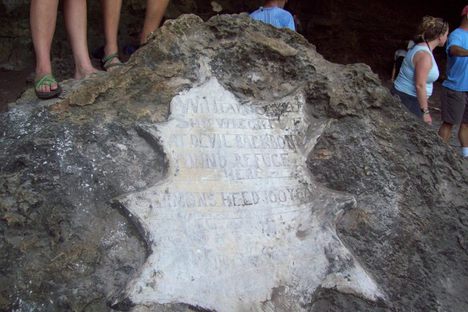 A plaque within the cave.