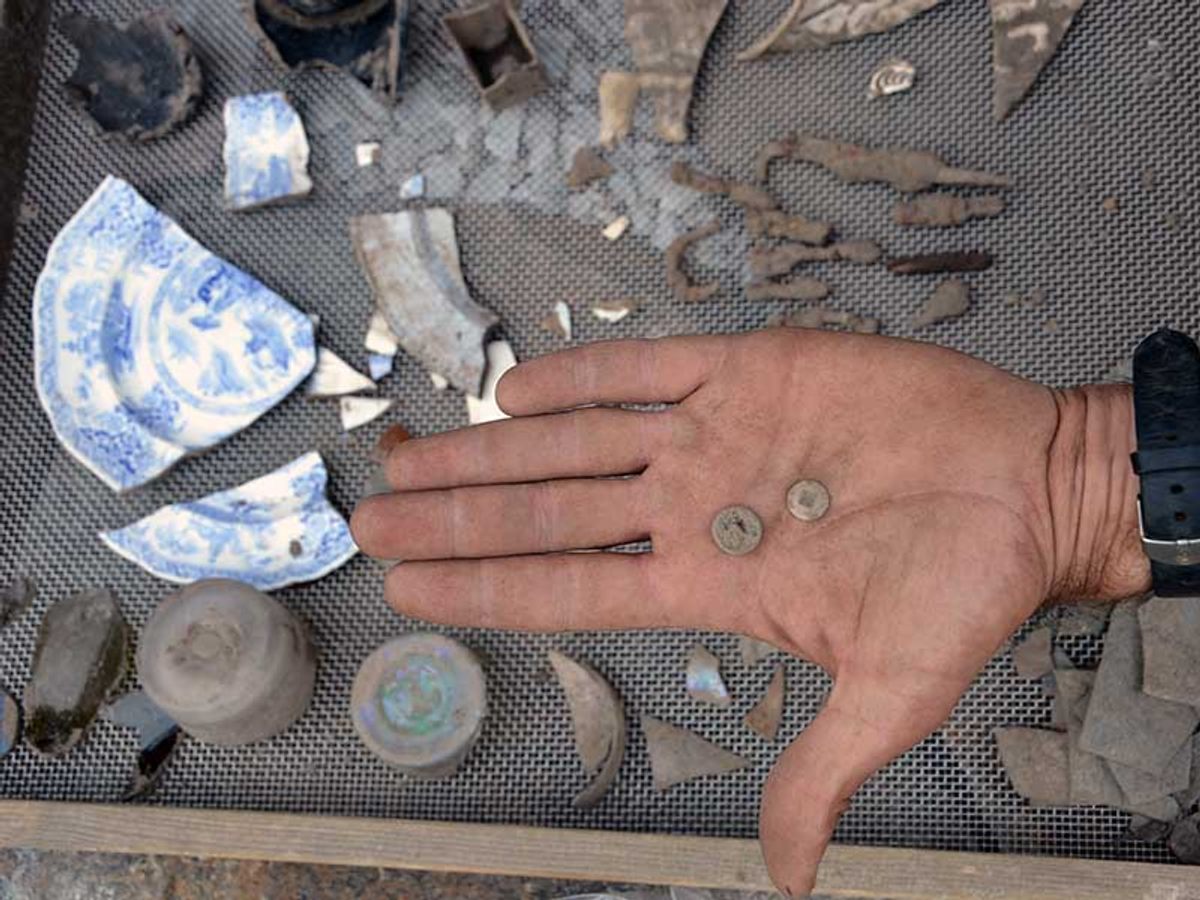 Archaeologists found plates, buttons, and other household goods at the Bayly cabin.