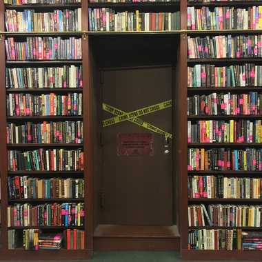 The door to Otto Penzler’s office in the Mysterious Bookshop, marked by police tape. 