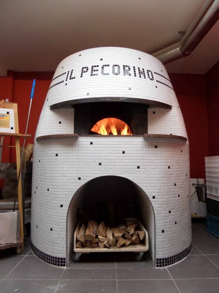 This handcrafted pizza oven in Amsterdam looks like a fire-eyed stormtrooper.