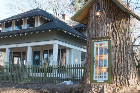 Behold, a tiny library made from a tree stump.