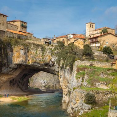 The natural arch forms a picturesque bridge.