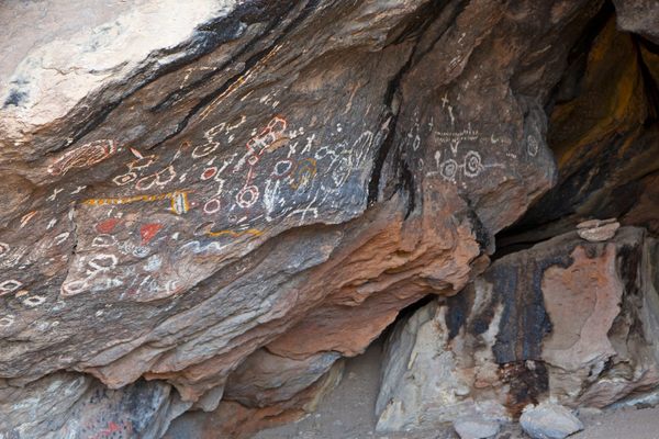 The pictographs use several pigments and line the cave walls
