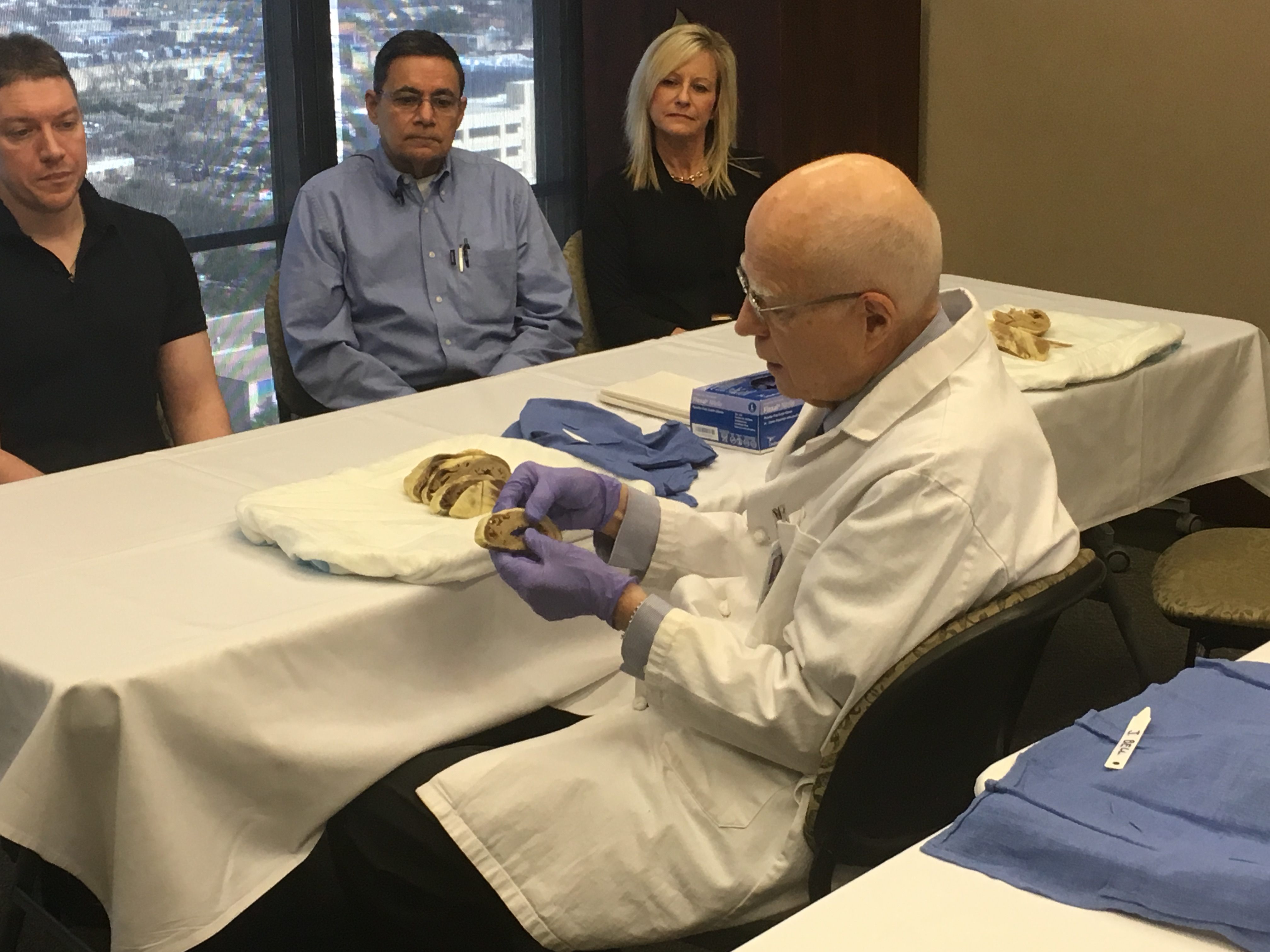 Dr. Roberts shows a native heart to a group of transplant patients and their loved ones.