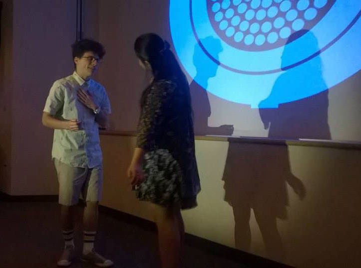 Noah Lerner and Helen Zhang perform a duet in Reactor! The Fermi Award-Winning Musical.