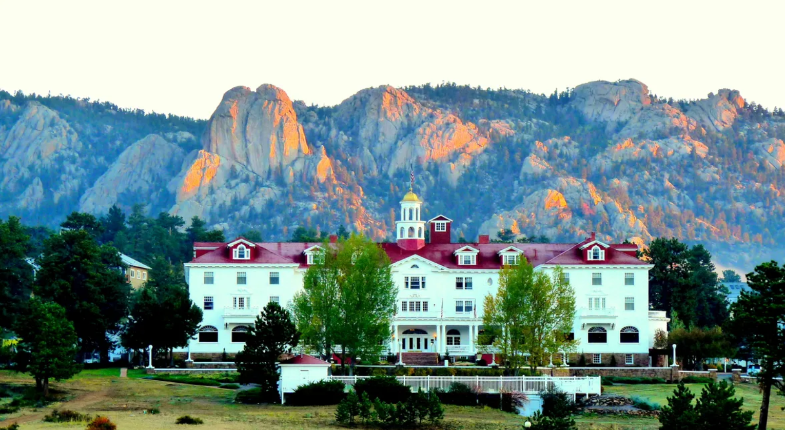 The hotel offers stunning views of Lake Estes, the Rockies, and Longs Peak.