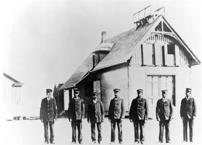 Richard Etheridge, left, with his crew in front of Pea Island lifesaving station, circa 1896.