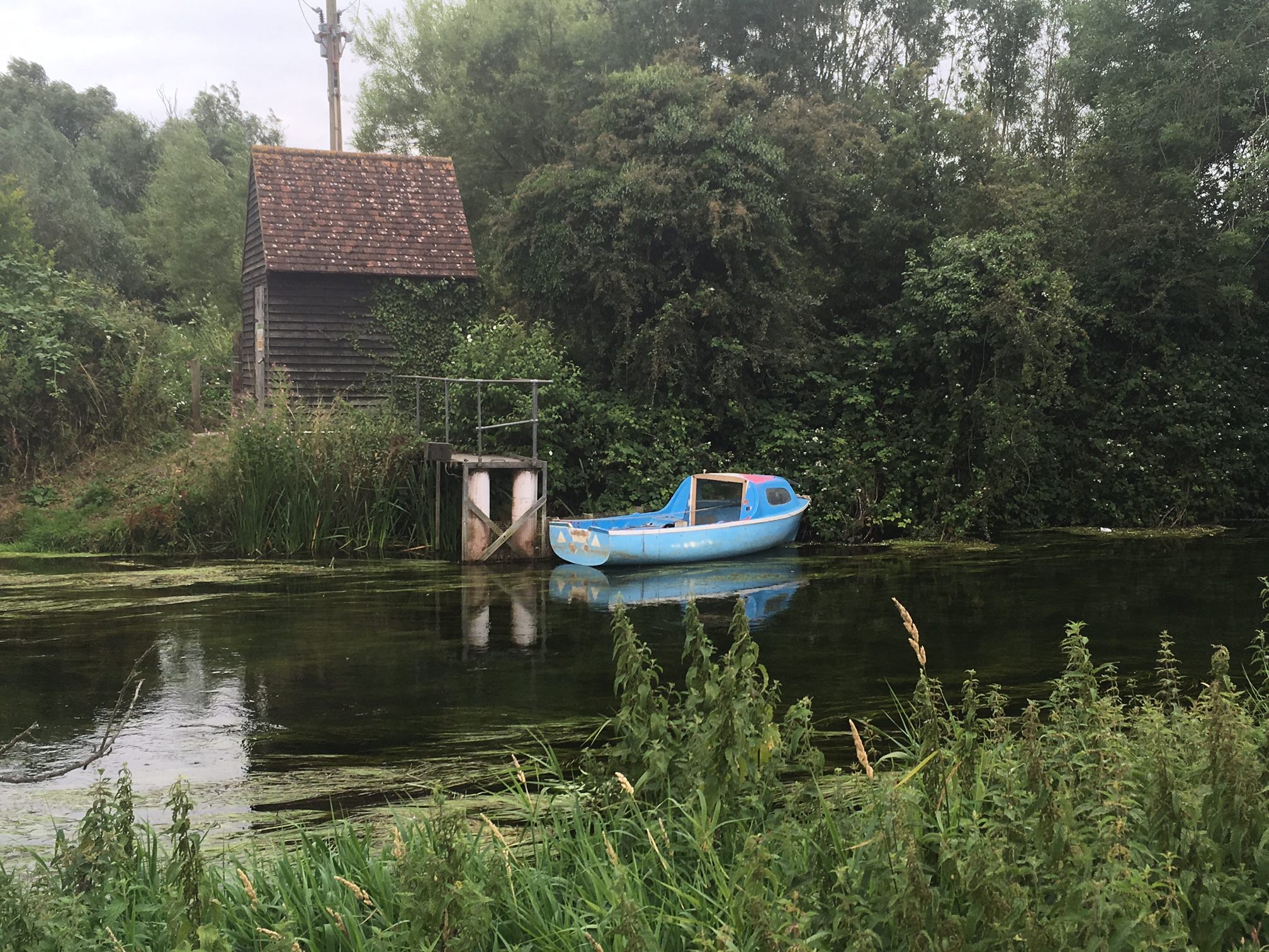 A boat on the Stour River, which is adjacent to the church. 