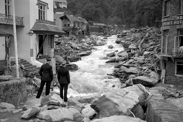 The flood swept through town, killing several people and destroying buildings and bridges.