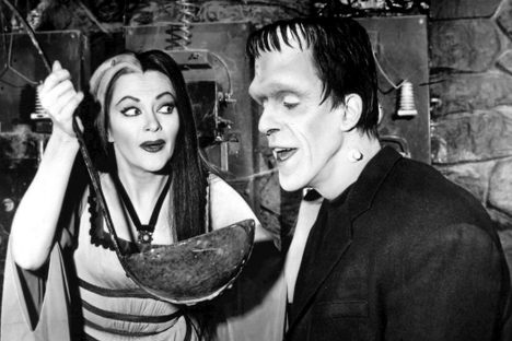 Fred Gwynne, on the right, in character as Herman in The Munsters.