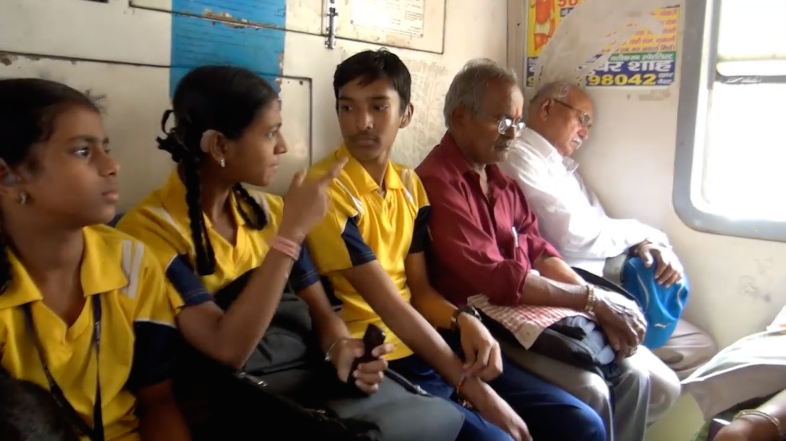 Deaf schoolchildren talk in the HC.