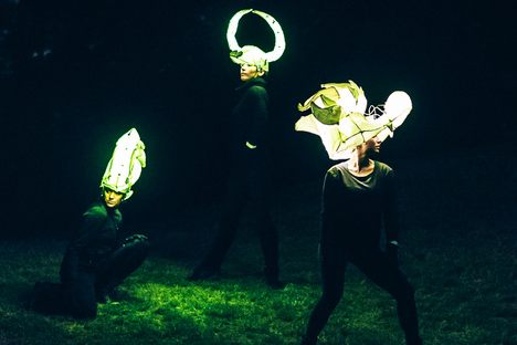 Dancers from Carte Blanche Performance set the night aglow from a cemetery hilltop.