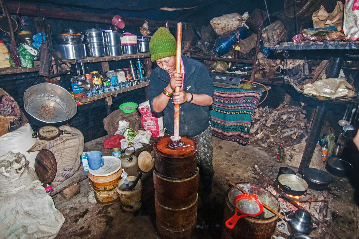 Churning yak milk in a Brokpa home near Tawang.
