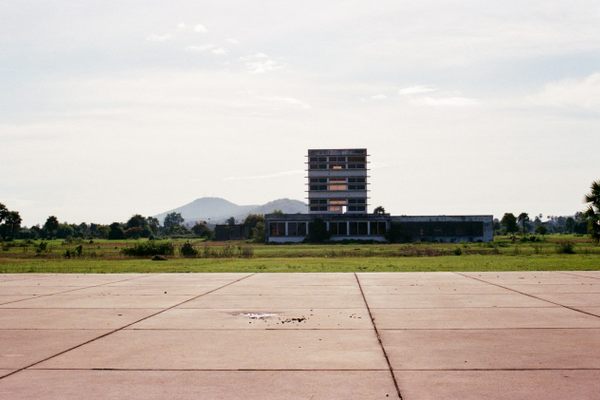 The control tower with the runway in the foreground.