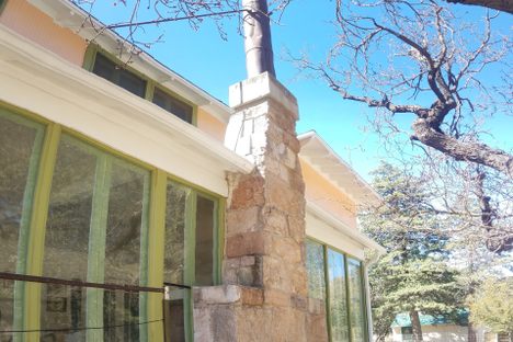 The fireplace from the outside of the ranch house.