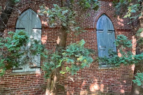 Original window shutters on the back of the building. 