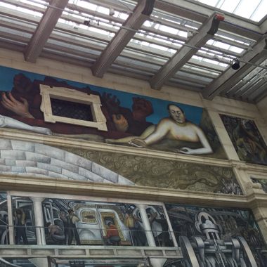 Diego Rivera's mural sprawls across a light-flooded room in the Detroit Institute of Arts.