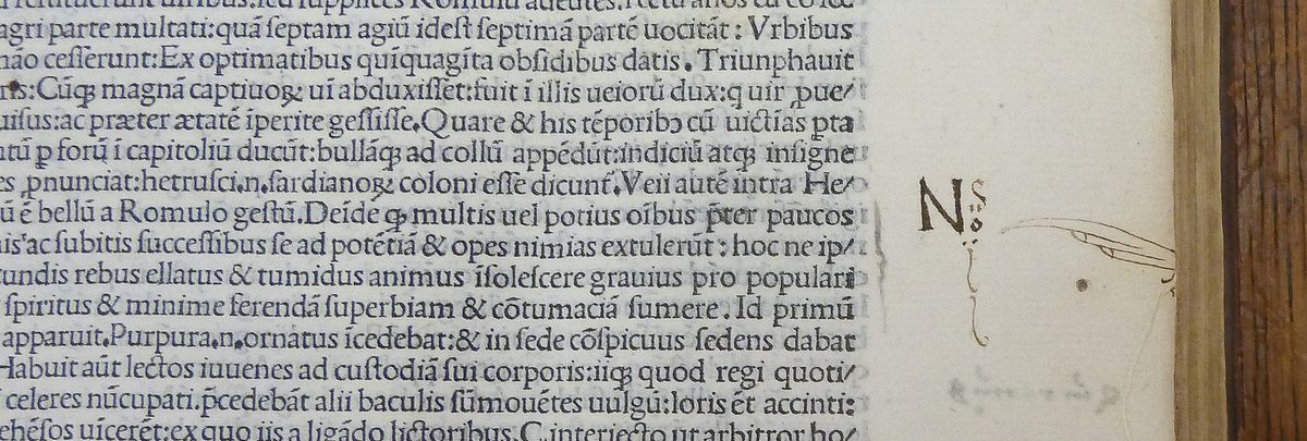 A three-fingered manicule creeping in from the edge of the page.
