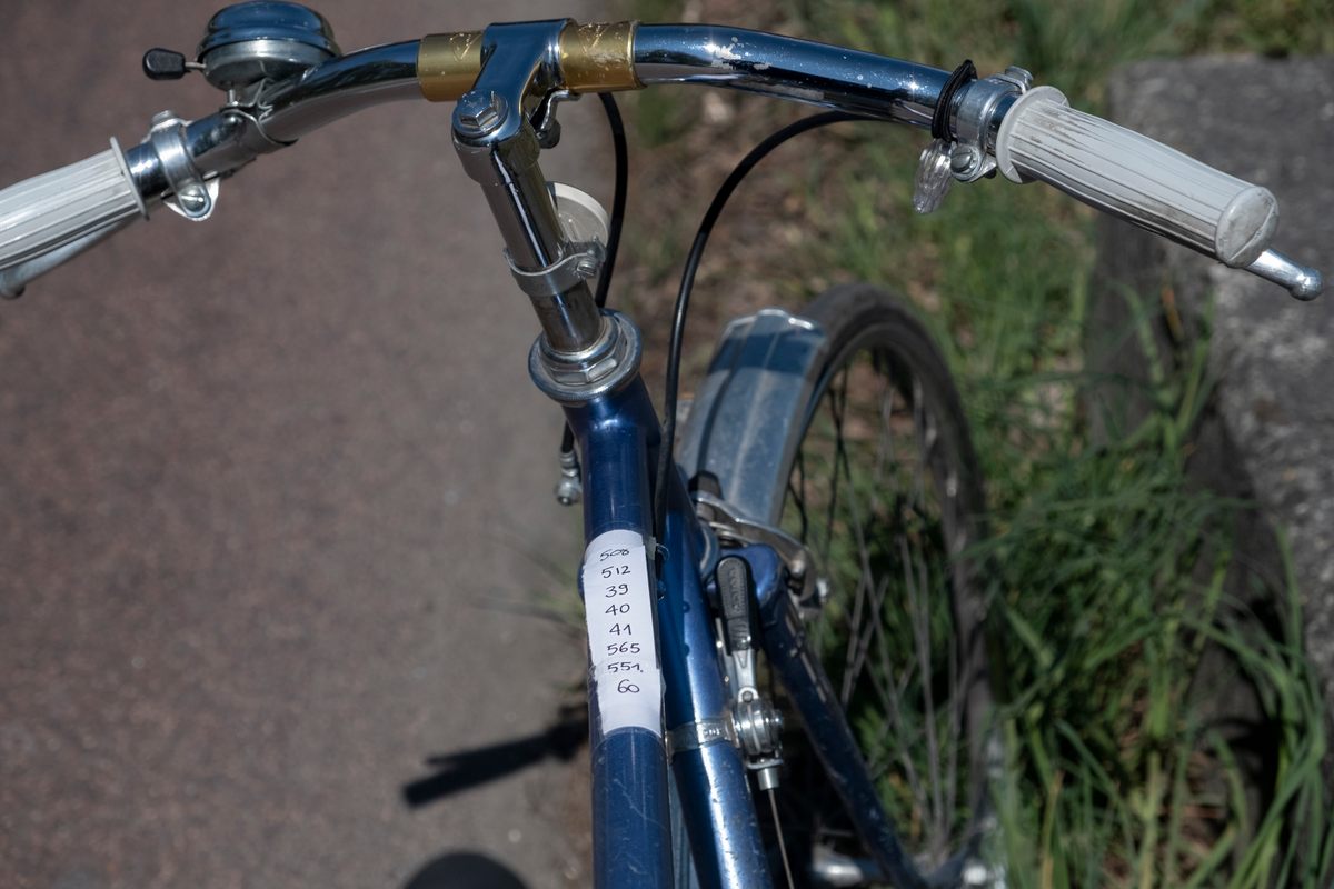 To avoid fiddling with a phone while riding, some cyclists tape their "number" to the bike frame.