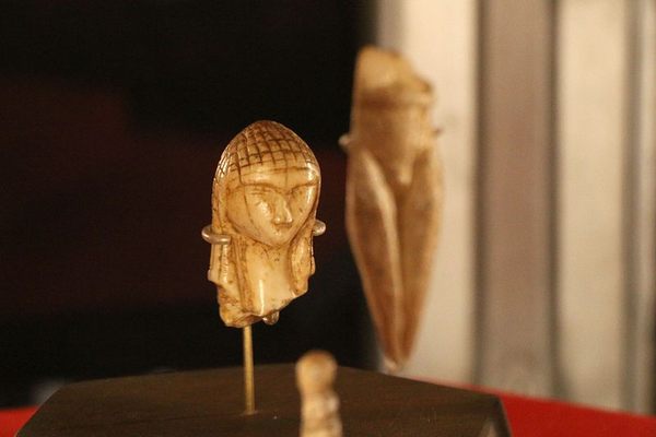 The Venus of Brassempouy on display with other artifacts at the National Archaeological Museum.