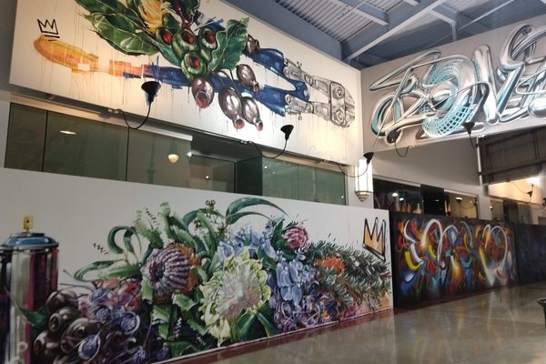 Empty stores are covered with art.