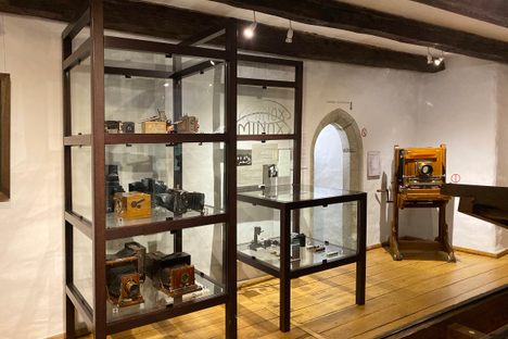 Vitrines with antique cameras.