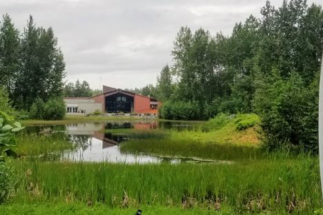 Alaska Native Heritage Center across Lake Tiulana