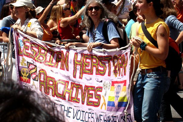 Womyn holding a banner for the Lesbian Herstory Archives during the 2007 LGBT Pride March in New York