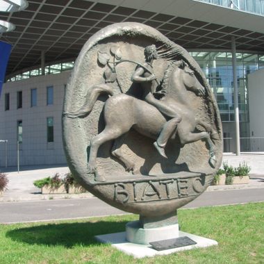 The monument in front of the National Bank building.
