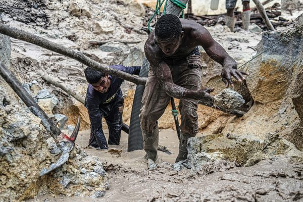 During grueling, 12-hour shifts, miners clear large stones from sediment before flooding the area and then pumping the water through filters in search of diamonds.